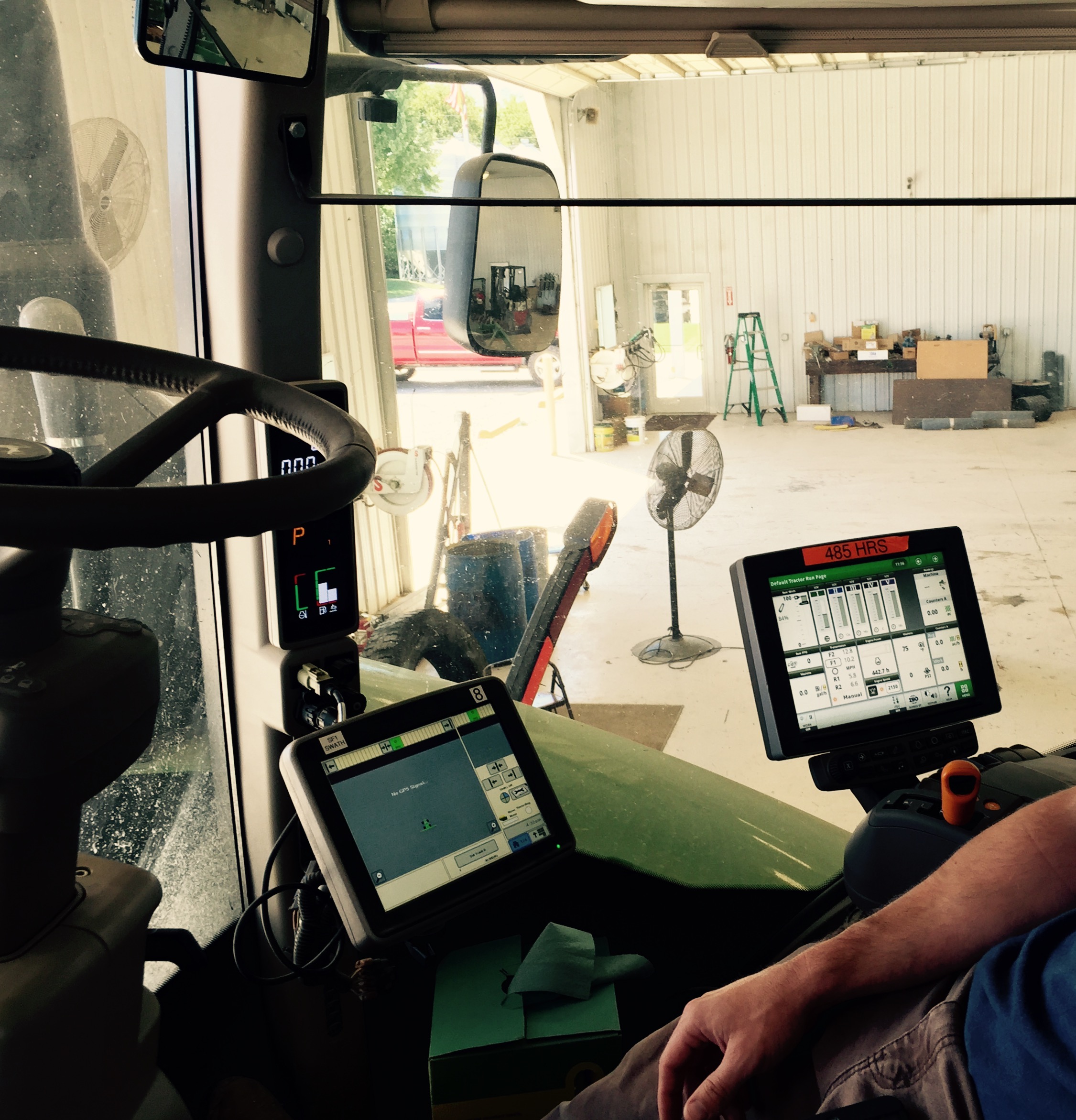 Inside the cabin of a self-driving tractor that harvests data as well as crops.