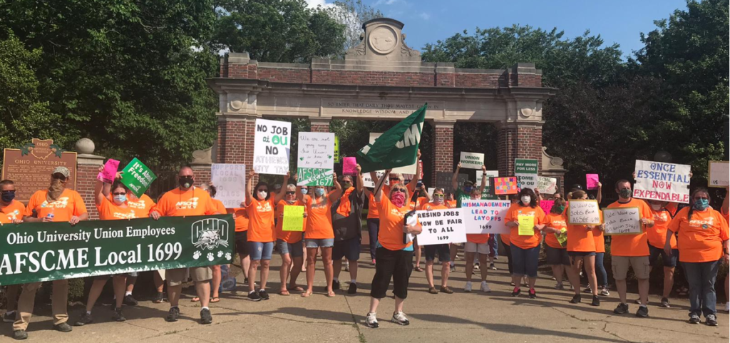 Union workers at Ohio University and supporters demand job cuts be reversed at a protest in June