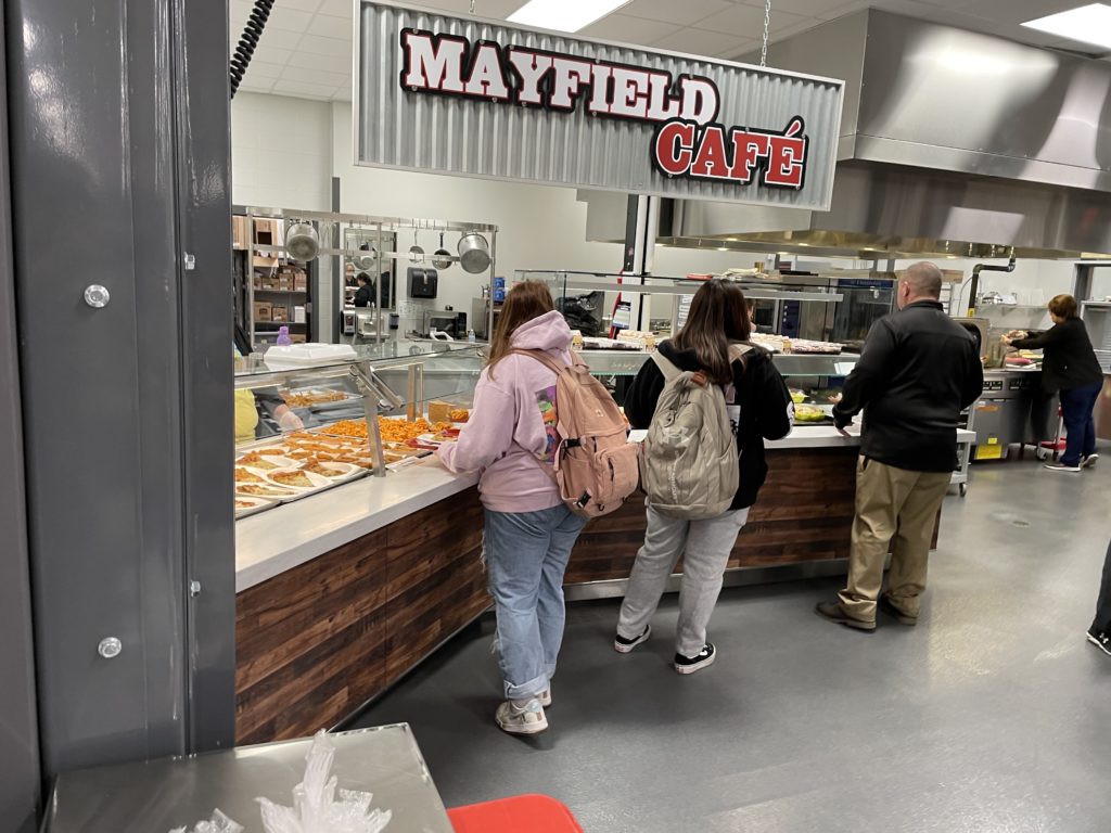 Children stand in line in cafeteria