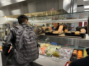 A student walks through a cafeteria line